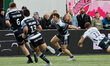Adam Radwan of Newcastle Falcons  beats Alex Lewington of Saracens on the outside during t...