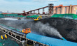 LIANYUNGANG, CHINA - NOVEMBER 13, 2023 - Transport vehicles transfer electric coal at the...