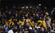 Fans enjoy themselves during the baseball game between the Las Aguilas Cibaenas and the Lo...