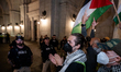 Protesters confront police during a Washington, DC rally demanding a ceasefire for Palesti...