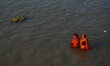 Devotees are seen offering their prayer to setting sun , during Chhath puja festival in Ko...