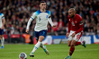 LONDON, ENGLAND - NOVEMBER 17: Phil Foden (L) of England and Malta's Teddy Teuma (R) in ac...