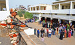 An ITBP jawan is keeping vigil while people are standing in queues to cast their votes for...
