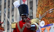 Performers dressed as wooden soldiers are waving to the crowd during the 97th Macy's Thank...