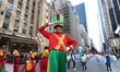 A helper is aboard the Santa's Sleigh float at The 97th Macy's Thanksgiving Day Parade in...