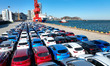 A large number of cars are gathering at a dock to be loaded onto a ship in Lianyungang, Ji...