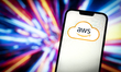 The Amazon Web Services cloud logo is seen in this photo illustration on 23 November, 2023...