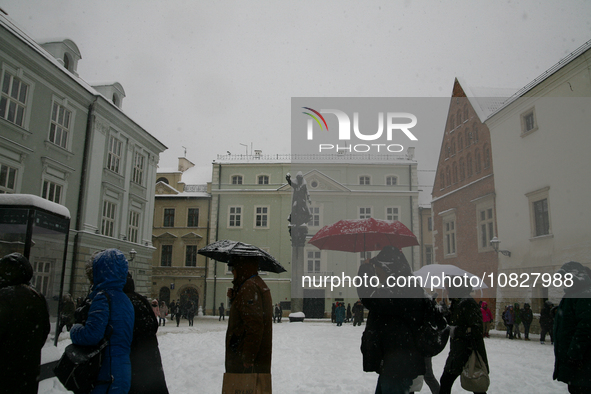 Snow is covering the city streets in Krakow, Poland, on December 2, 2023. 