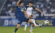 Baghdad Bounedjah (R) of Al Sadd SC and Gaybullaev Golib (L) of FC Nasaf are battling for...