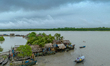 A house is seen almost damaged after a heavy storm in Khulna, Bangladesh, on December 6, 2...
