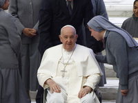 Nuns are greeting Pope Francis during his weekly general audience in the Pope Paul VI hall at the Vatican, on December 6, 2023. (