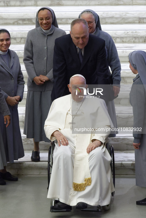 Nuns are greeting Pope Francis during his weekly general audience in the Pope Paul VI hall at the Vatican, on December 6, 2023. 