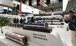 Visitors are taking photos of a smart bullet train at the 2023 World Intelligent Manufactu...