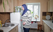 A Ukrainian citizen named Tetiana, who was evacuated from Gaza, is seen in the kitchen of...