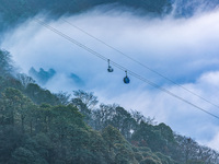 Tourists are taking a ropeway tour of the Golden Buddha Mountain Scenic Area in Chongqing, China, on December 6, 2023. (
