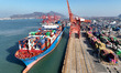 The COSCO Shipping container ship ''Lotus'' is preparing to dock at a container terminal t...