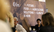 Participants work in a pavilion during the COP28, UN Climate Change Conference, held by UN...