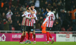 Sunderland's Luke O'Nien, Daniel Ballard, Trai Hume, and Niall Huggins are celebrating at...