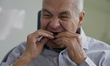 An older adult is being fitted with a dental prosthesis at the Centro de Odontogeriatria C...