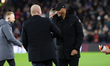 Sean Dyche, the Everton manager, is greeting Vincent Kompany, the Burnley manager, before...
