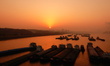Cargo ships are waiting to pass through the Gezhouba lock on the Yangtze River at sunrise...