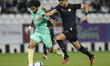 Akram Hassan Afif of Al-Sadd SC (left) and Marouane Louadni of Umm Salal SC (right) are pl...