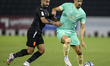 Baghdad Bounedjah (R) of Al-Sadd SC is competing against Adel Alawi Al-Soleymani (L) of Um...