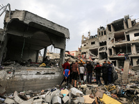 Palestinians are searching through building rubble for survivors following Israeli strikes on the al-Maghazi refugee camp in the central Gaz...