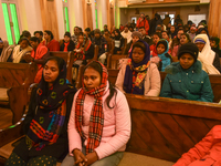 People are attending a ceremony inside the Holy Family Catholic Church on Christmas Day in Srinagar, Indian Administered Kashmir, on Decembe...