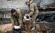 Soldiers of the 65th Separate Mechanised Brigade are preparing meat for cooking in the Zap...