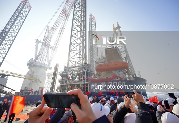 Guests are celebrating the delivery of the ''Bo Qiang 3060'' wind power installation ship at the CIMC Raffles Yantai construction base in Ya...