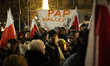 People are seen protesting against government media reforms in front of the public broadca...
