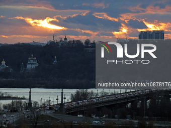 A view of the sunset over the right bank of Kyiv, the capital of Ukraine, in Kyiv, Ukraine, on December 27, 2023. (