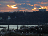 A view of the sunset over the right bank of Kyiv, the capital of Ukraine, in Kyiv, Ukraine, on December 27, 2023. (