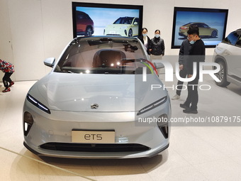 A citizen is experiencing an ET5 car at a NIO electric car store in Shanghai, China, on March 19, 2023. (