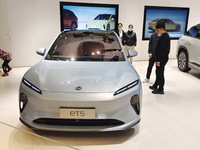 A citizen is experiencing an ET5 car at a NIO electric car store in Shanghai, China, on March 19, 2023. (
