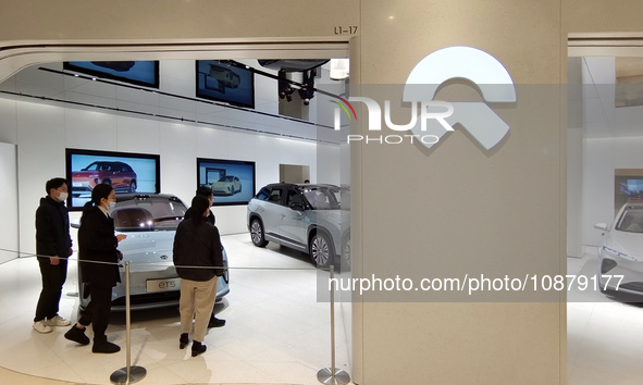 Citizens are experiencing an ET5 car at NIO's electric car store in Shanghai, China, on March 19, 2023. 