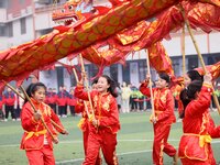 Primary school students are performing a traditional dragon dance in Hefei, Anhui province, China, on December 29, 2023. (