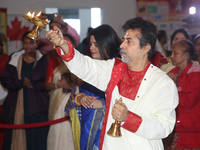 A Bengali Hindu priest is performing special prayers during the Durga Puja festival at a pandal (temporary temple) in Mississauga, Ontario,...