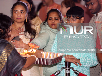 Bengali Hindus are taking blessings during the Durga Puja festival at a pandal (temporary temple) in Mississauga, Ontario, Canada, on Octobe...