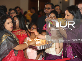 People are receiving blessings during the Durga Puja festival at a pandal (temporary temple) in Mississauga, Ontario, Canada, on October 22,...