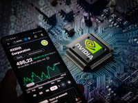 A smart phone is displaying the NVIDIA Corporation stock price on the NASDAQ market, with an NVIDIA chip visible in the background, in this...