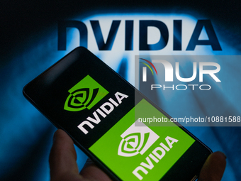 The NVIDIA logo is being displayed on a smart phone, with an NVIDIA chip visible in the background, in this photo illustration taken in Brus...