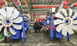 A worker is assembling a generator at a manufacturing enterprise in Qingzhou, East China's...