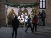 Iranian-Christian youths are standing together at the Saint Targmanchats Church in eastern Tehran, before the beginning of a New Year mass p...