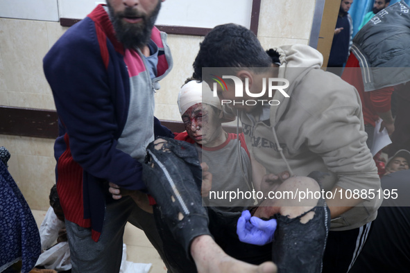 (EDITOR'S NOTE: Graphic content) Wounded Palestinians are receiving treatment at Al-Aqsa hospital in Deir al-Balah, central Gaza Strip, on J...