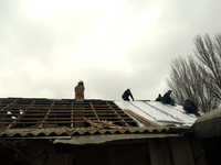 Men are repairing the roof of a house damaged in the Russian overnight drone attack, which claimed the life of one civilian and left three o...