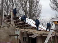 Men are repairing the roof of a house damaged in the Russian overnight drone attack, which claimed the life of one civilian and left three o...