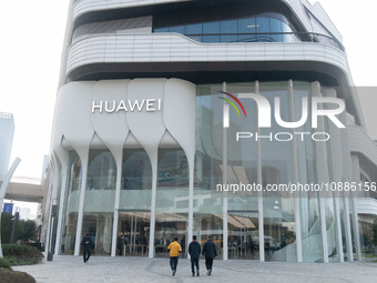 Customers are walking past the most beautiful Huawei flagship store in Shanghai, China, on January 2, 2024. (