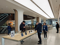 Customers are selecting and buying various Huawei products at its flagship store in Shanghai, China, on January 2, 2024. (